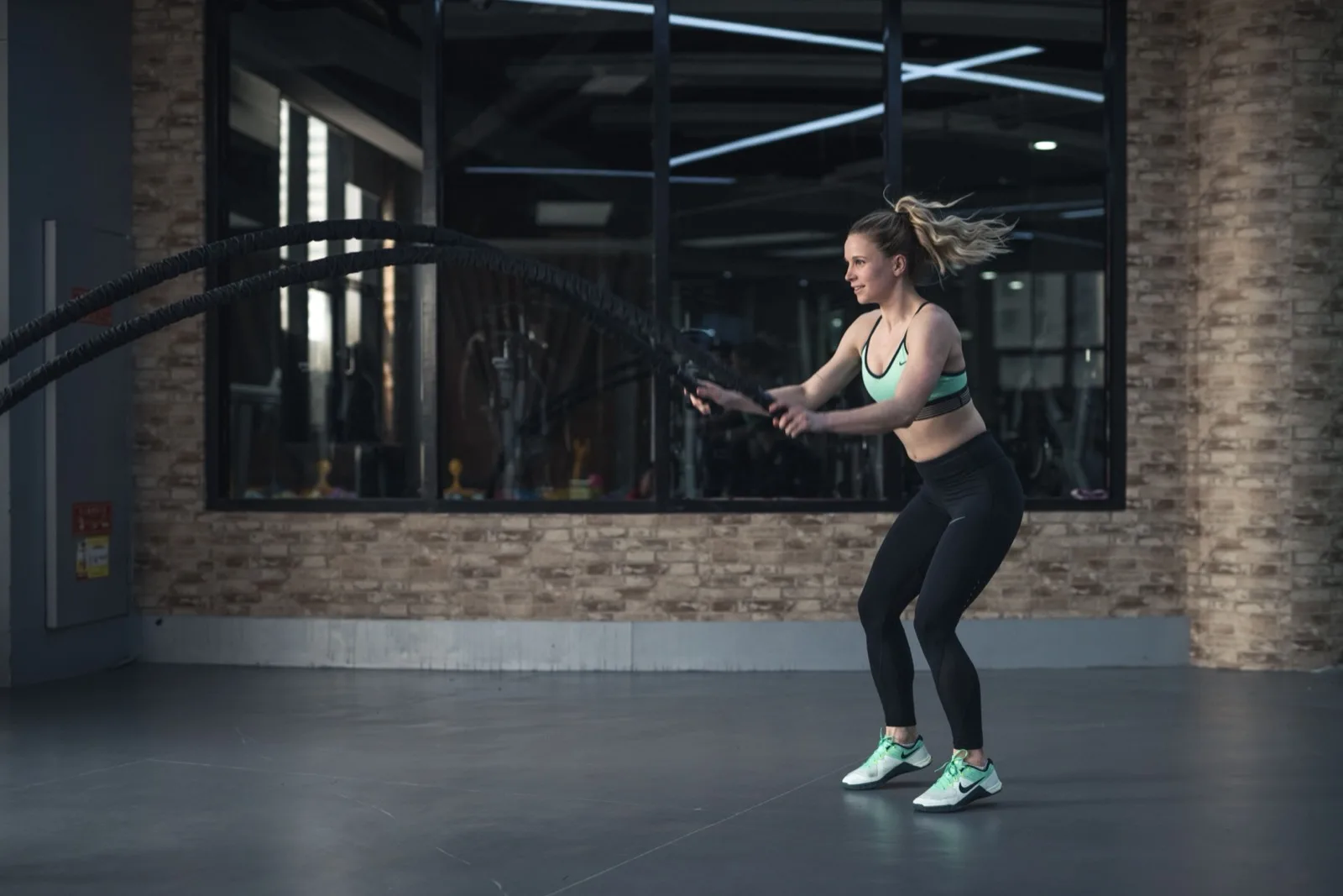 Battle-rope conditioning in an industrial training space