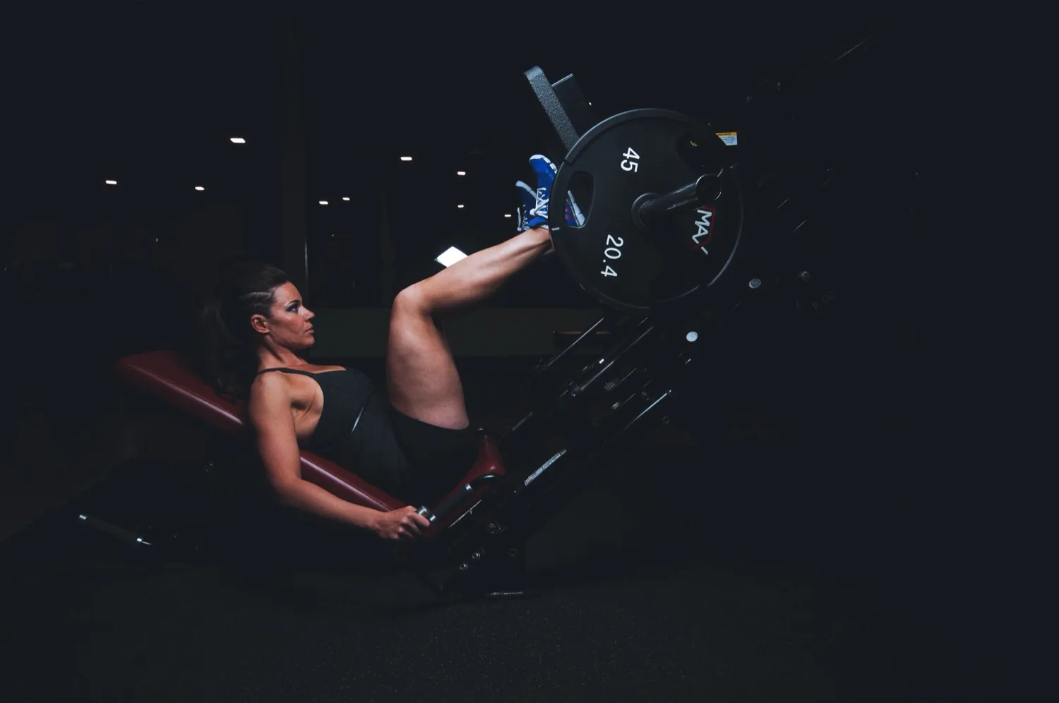 A single athlete training in low, focused light